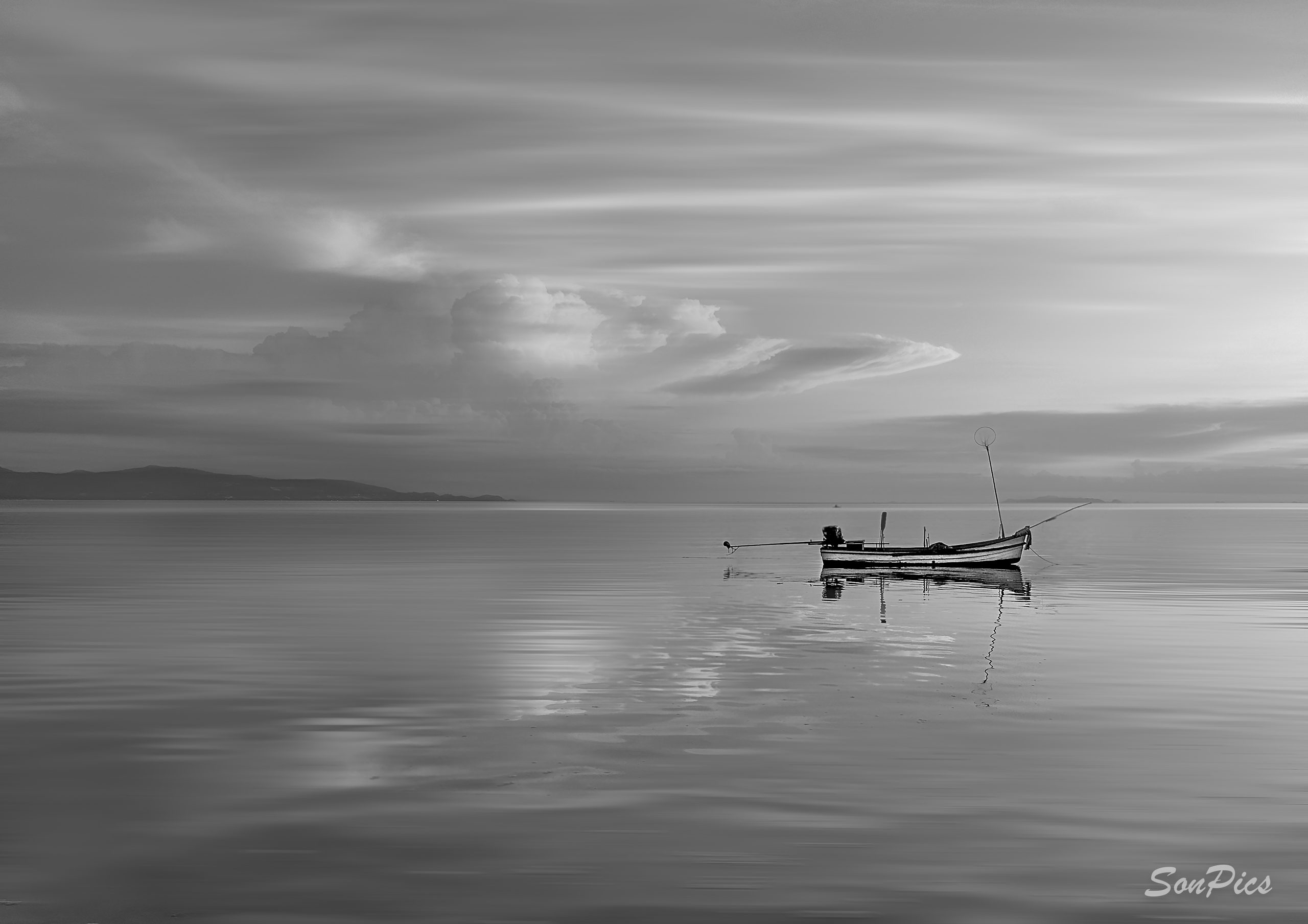Sonja - Sonpics photography: small boat on streaky water with clouds shop pagelouds